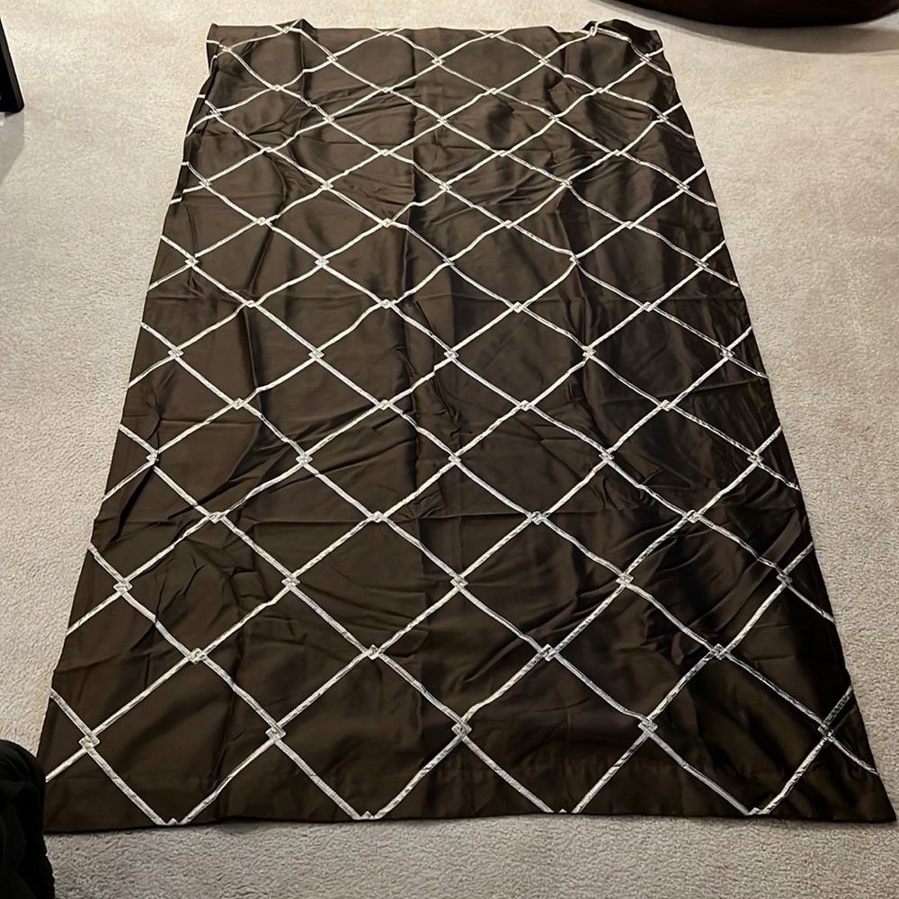 2 curtain panels in chocolate brown with decorative stitch. 93.5”L X 52” W.